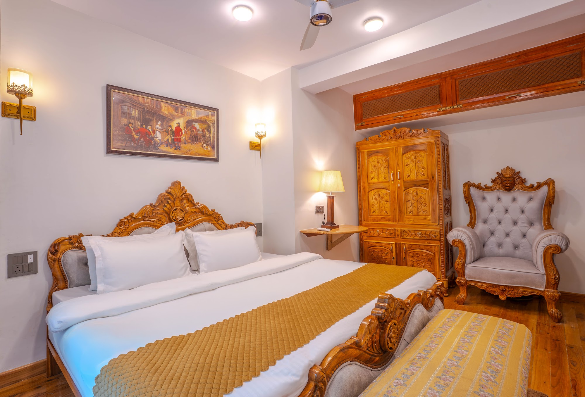 Bedroom in the Hall Balcony Suite with carved wooden furniture