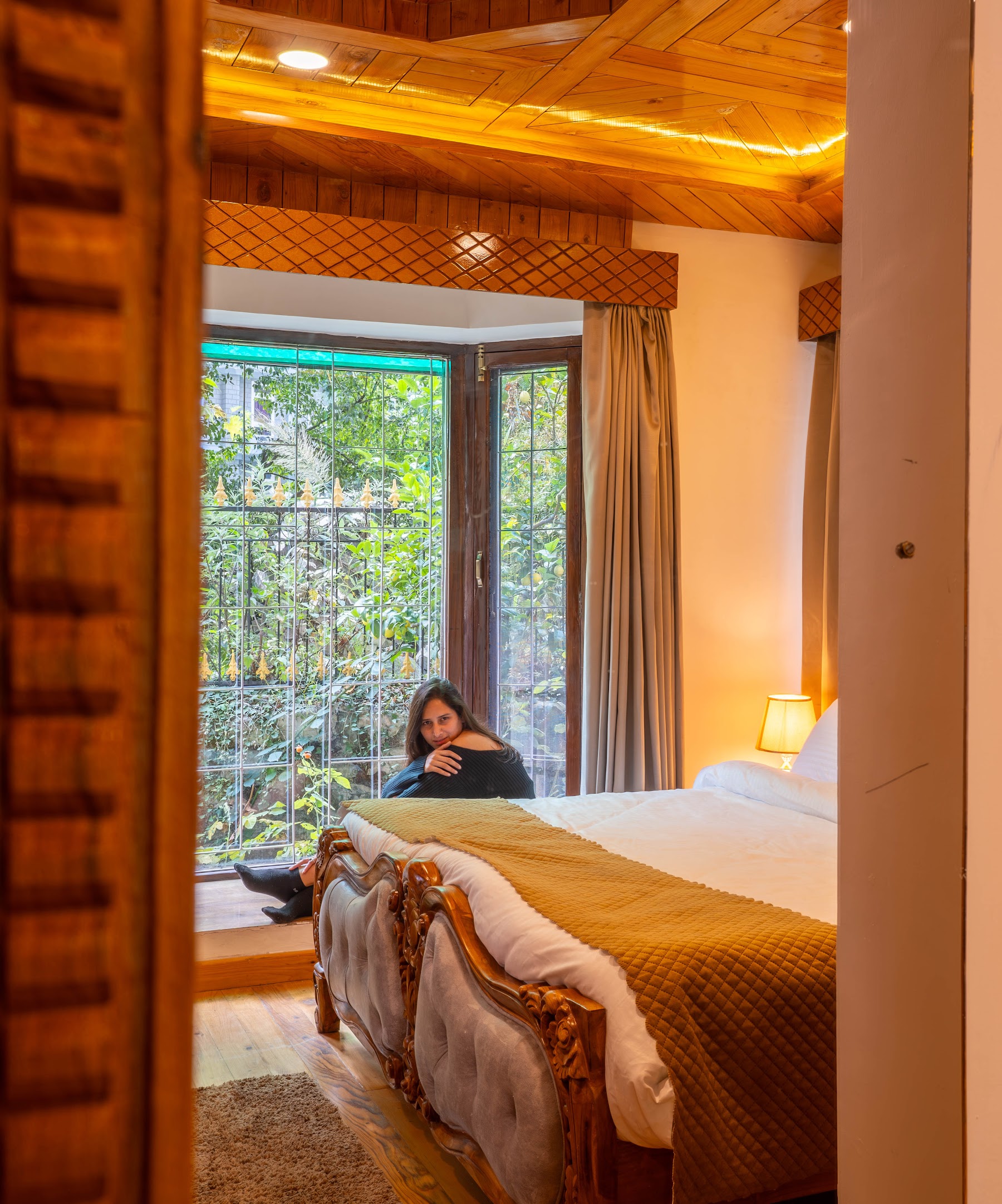 Bedroom with forest views in the Courtyard Suite