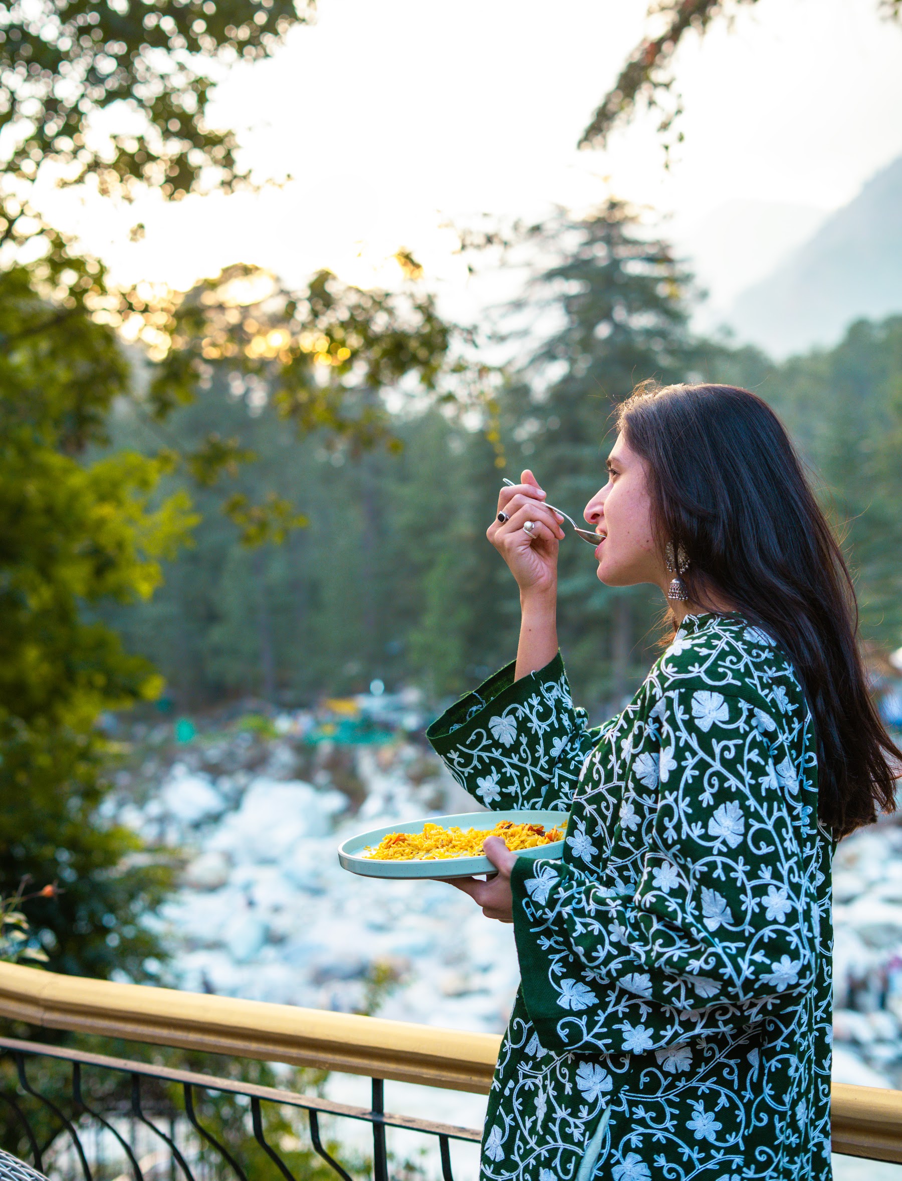 Guest enjoying tea in the garden with mountain views