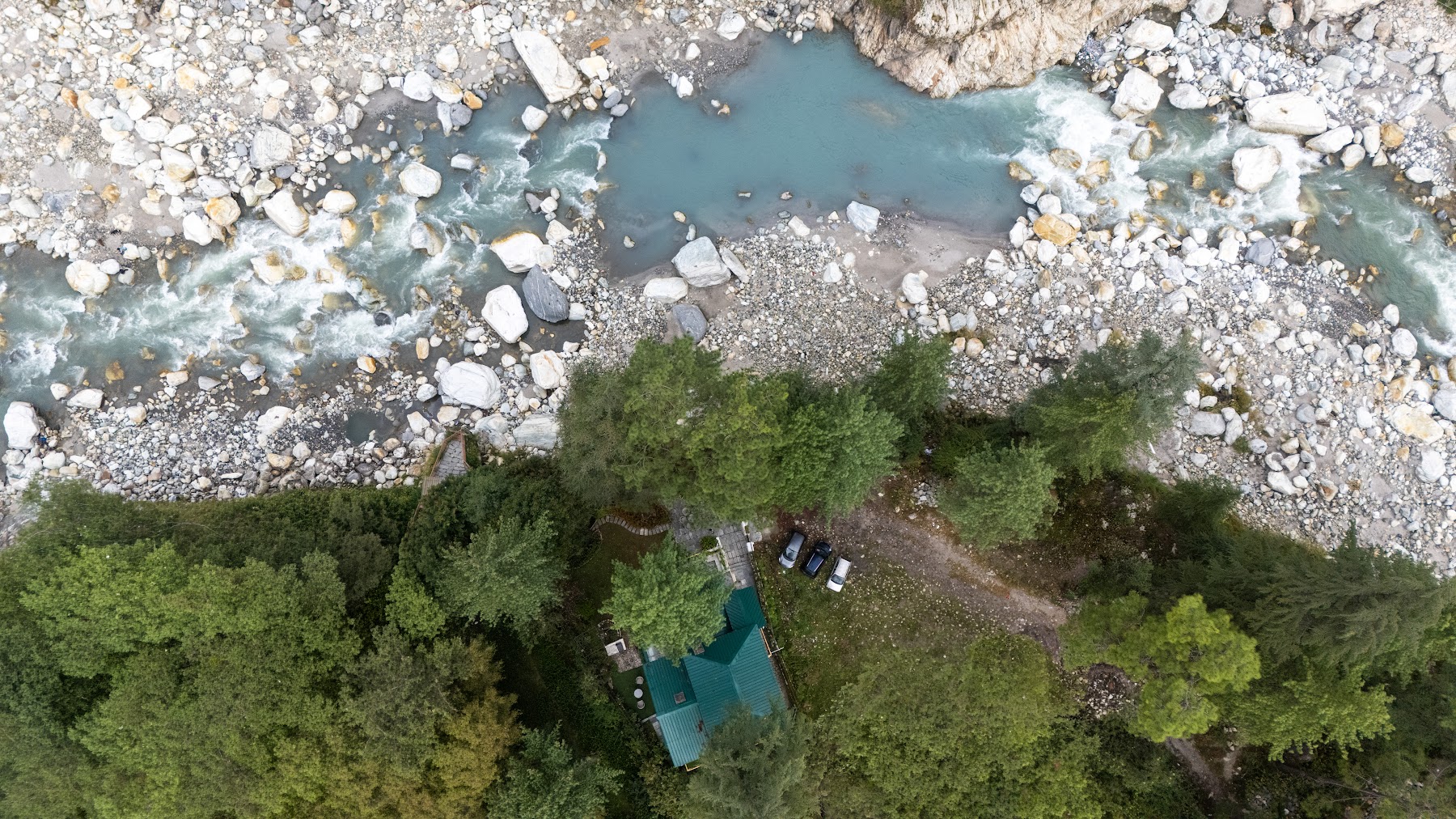High aerial view of River Stone Villa and the Parvati Valley