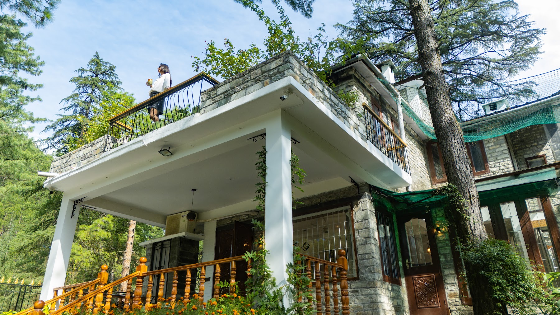 Aerial view of River Stone Villa from above the trees