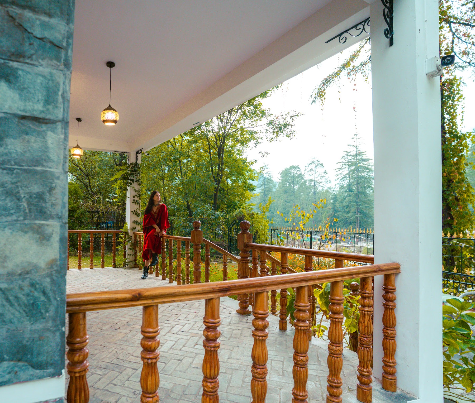 Veranda with timber railings at River Stone Villa