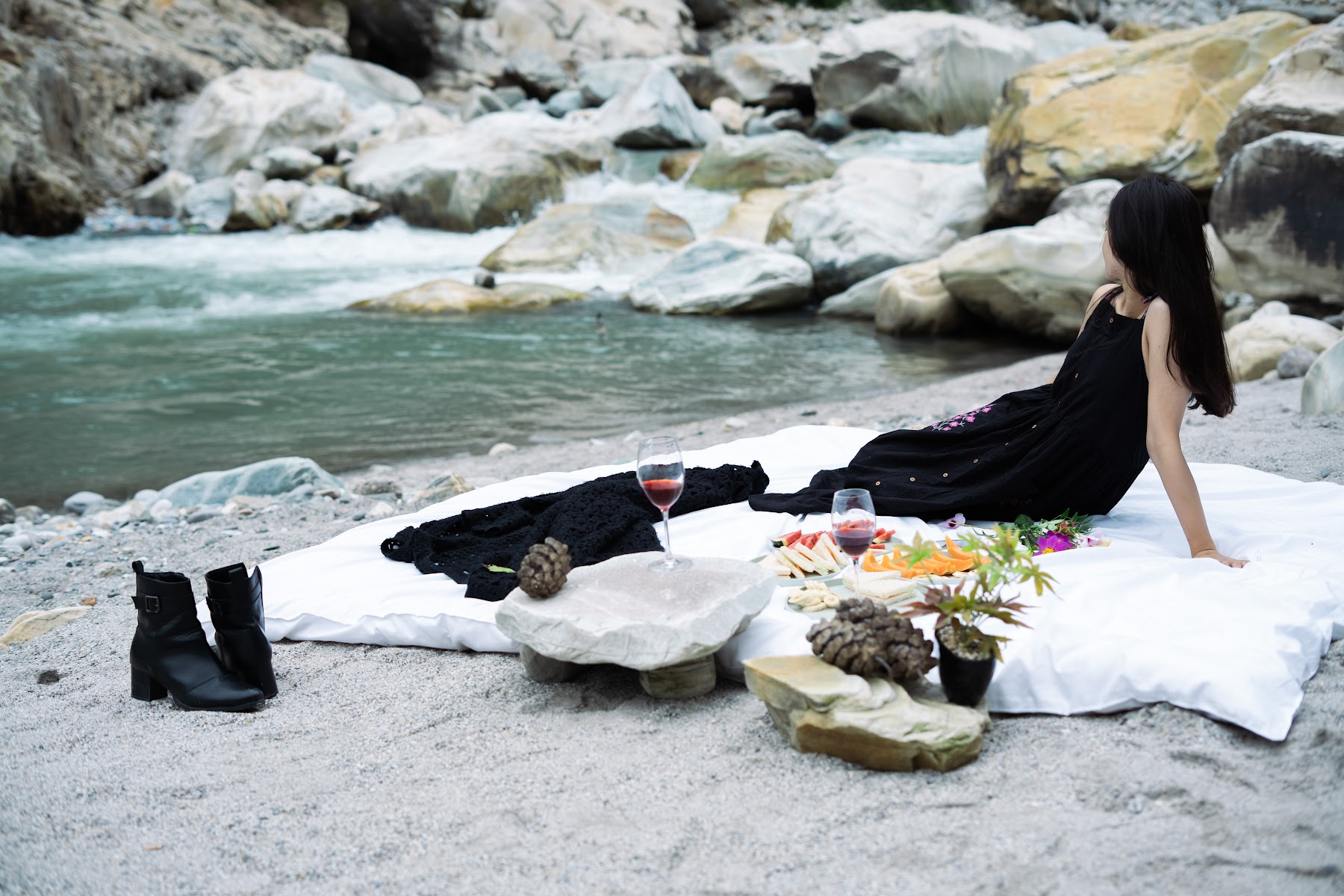 Picnic spread by the river among the rocks